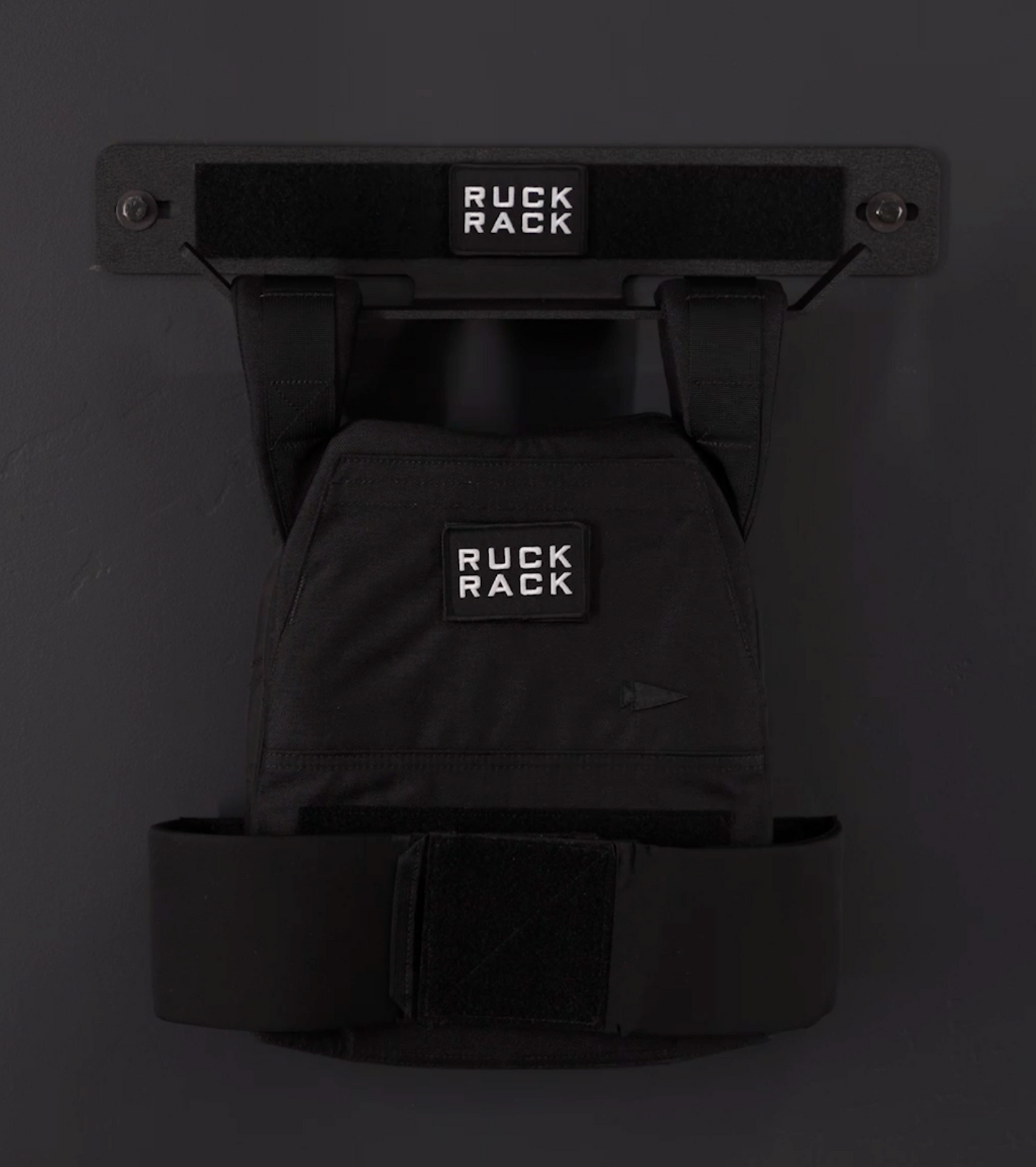 Black Ruck Rack product on a dark background storing weight vest
